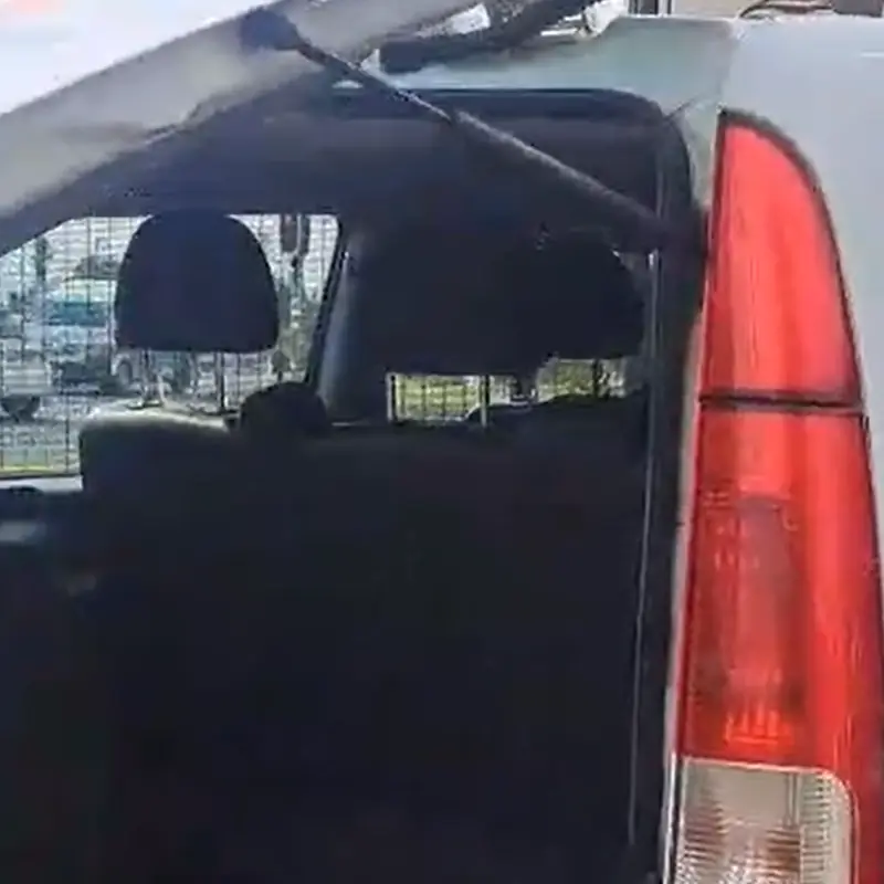 White Combi open tailgate supported by a gas strut